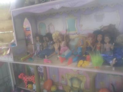 Barbie doll house with collectable barbies and accessories for sale in
