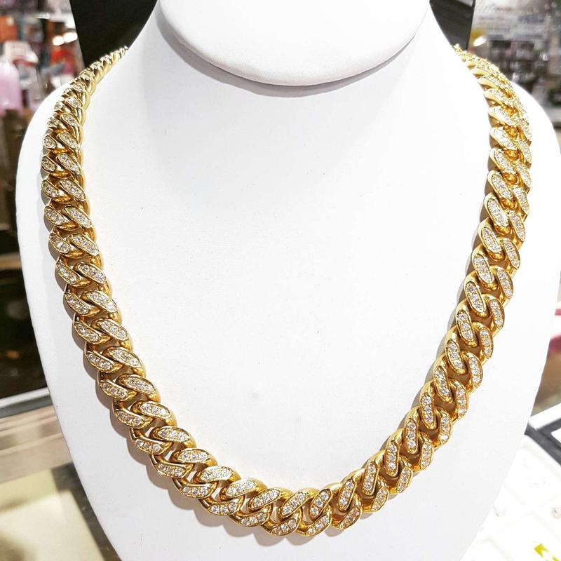 Gold Cuban link chain bust down with 