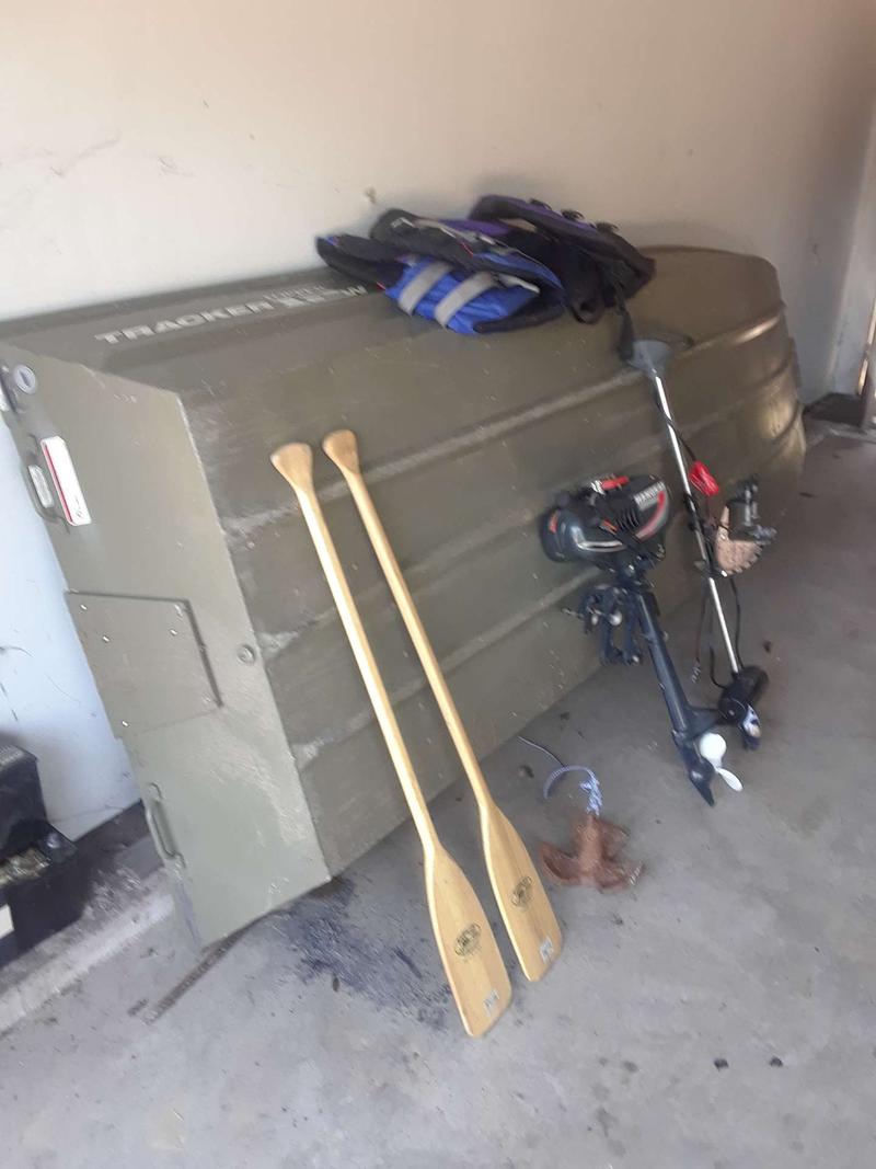Jon Boat 12 foot with two paddles to life jackets an anchor a gasoline