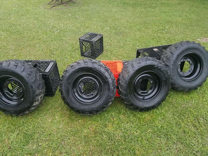 Original tires and wheels from a Polaris 570 Sportsman, used in good
