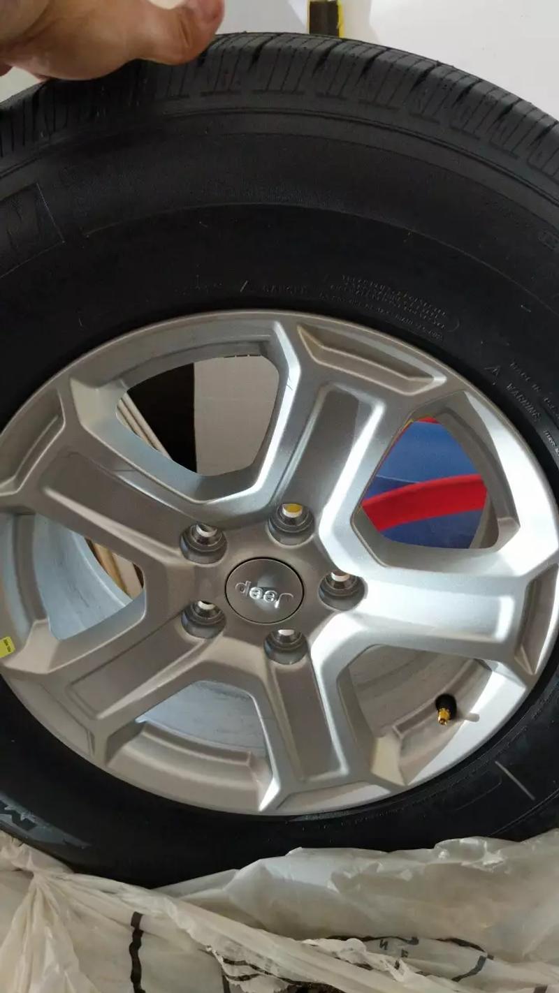 Michelin tires with original jeep grand rims for sale in Katy, TX