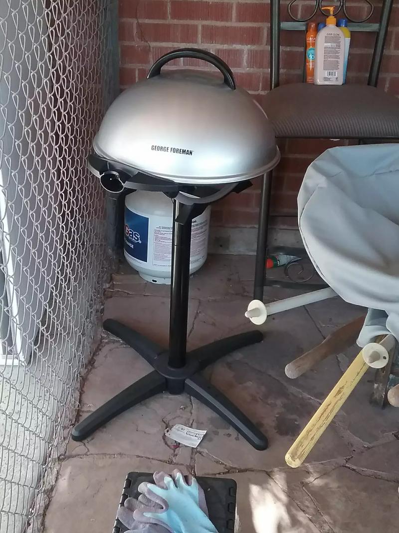 1. Indoor/outdoor Foreman electric grill w/cover, used twice