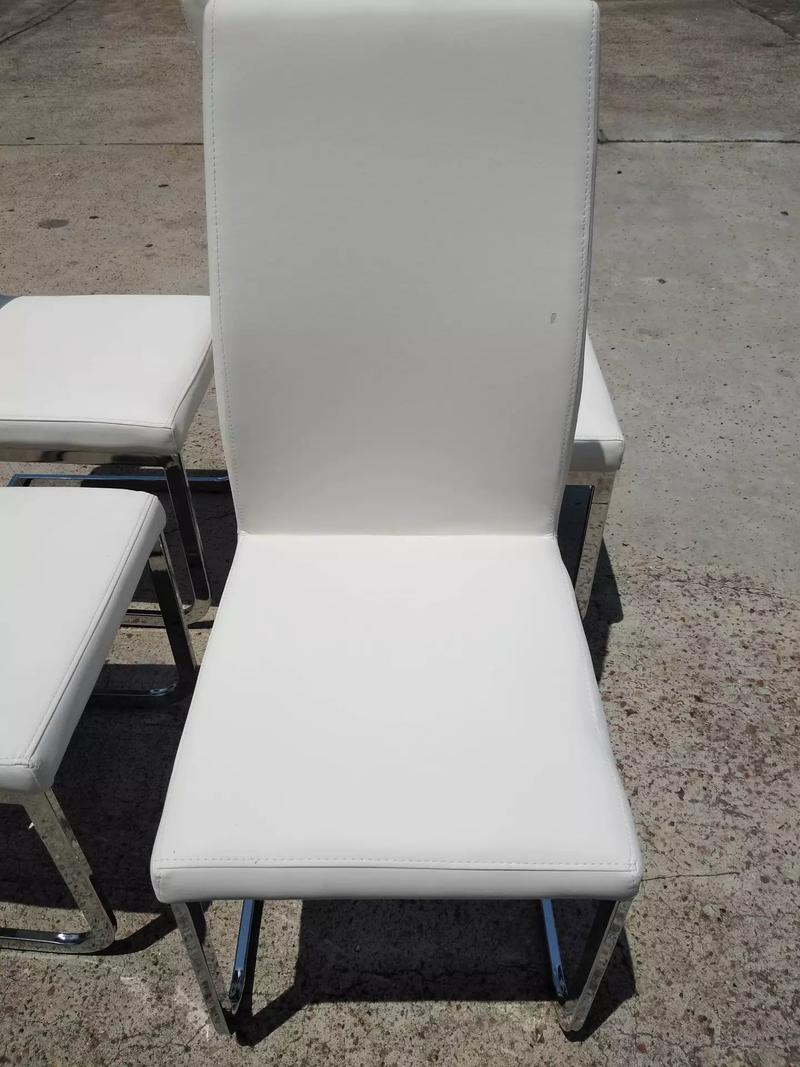 This 4 white leather chairs are on sale for ONLY for sale in Houston