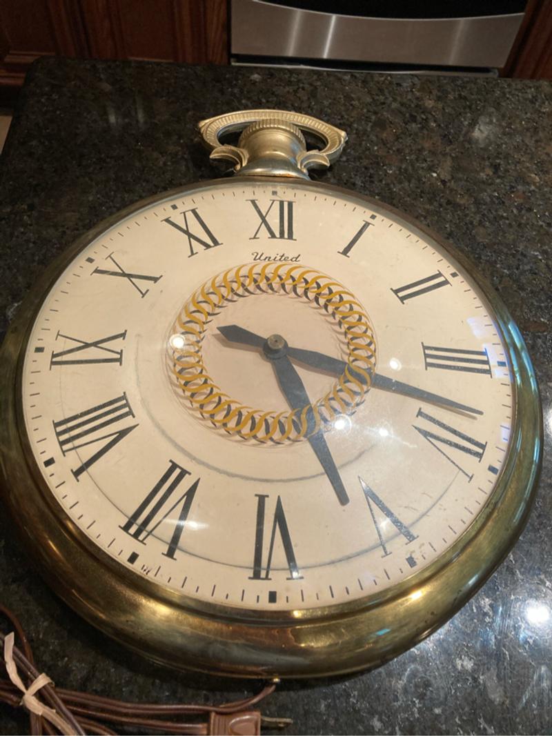 Vintage United Pocket Watch Wall Clock with motion Model for sale in