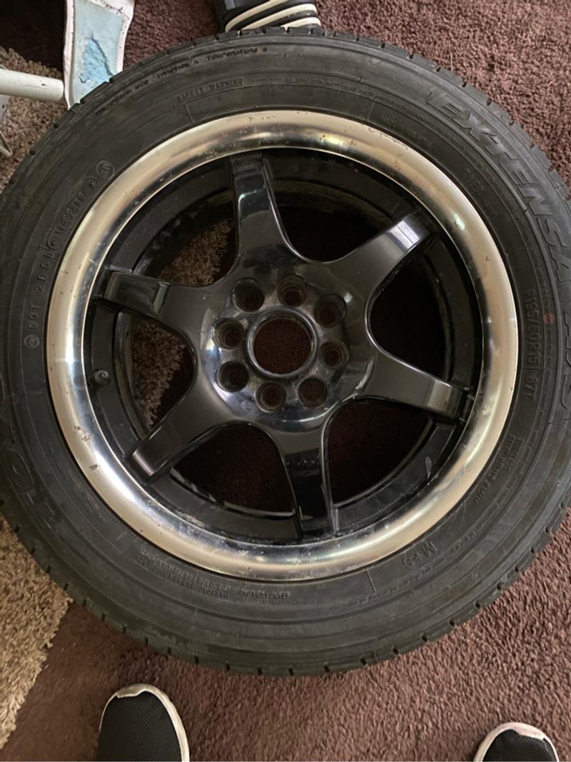 A set of 4 lug universal rims. With good toyo tires on them for sale in