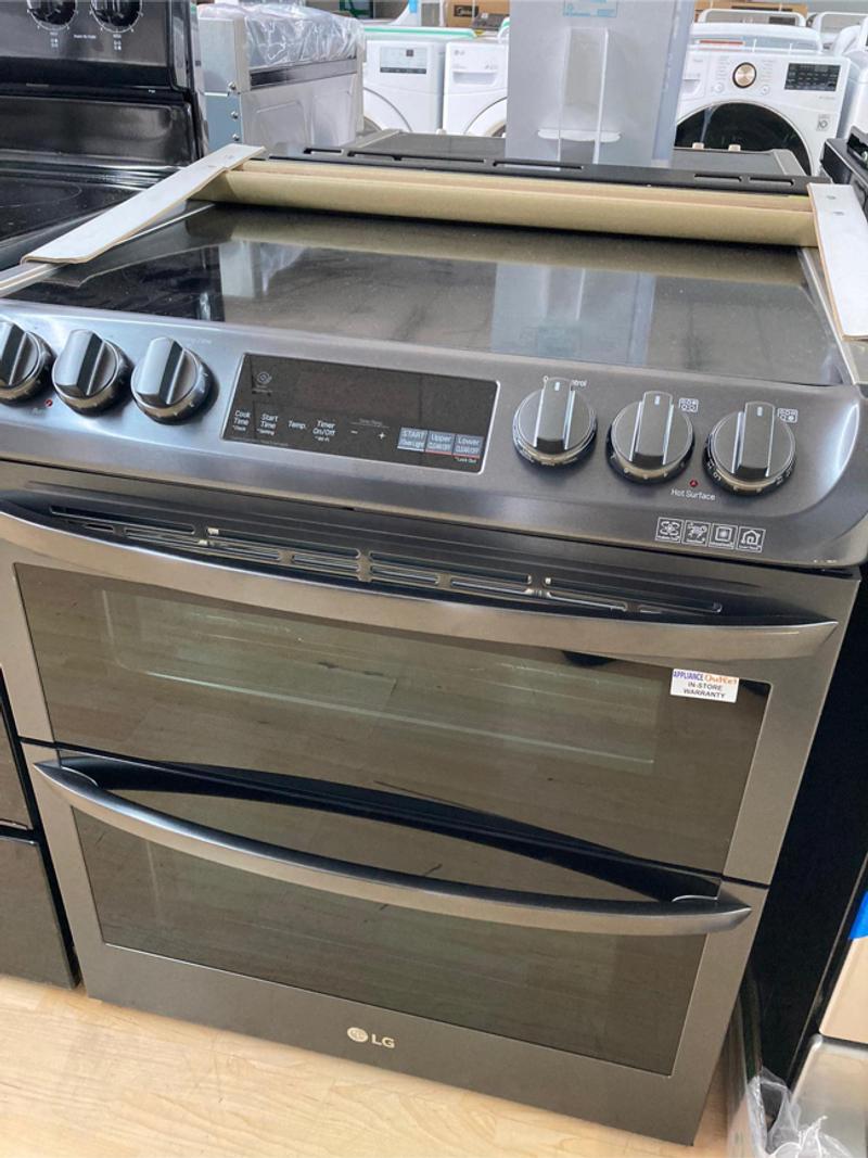 New black stainless LG electric stove with double oven for sale in