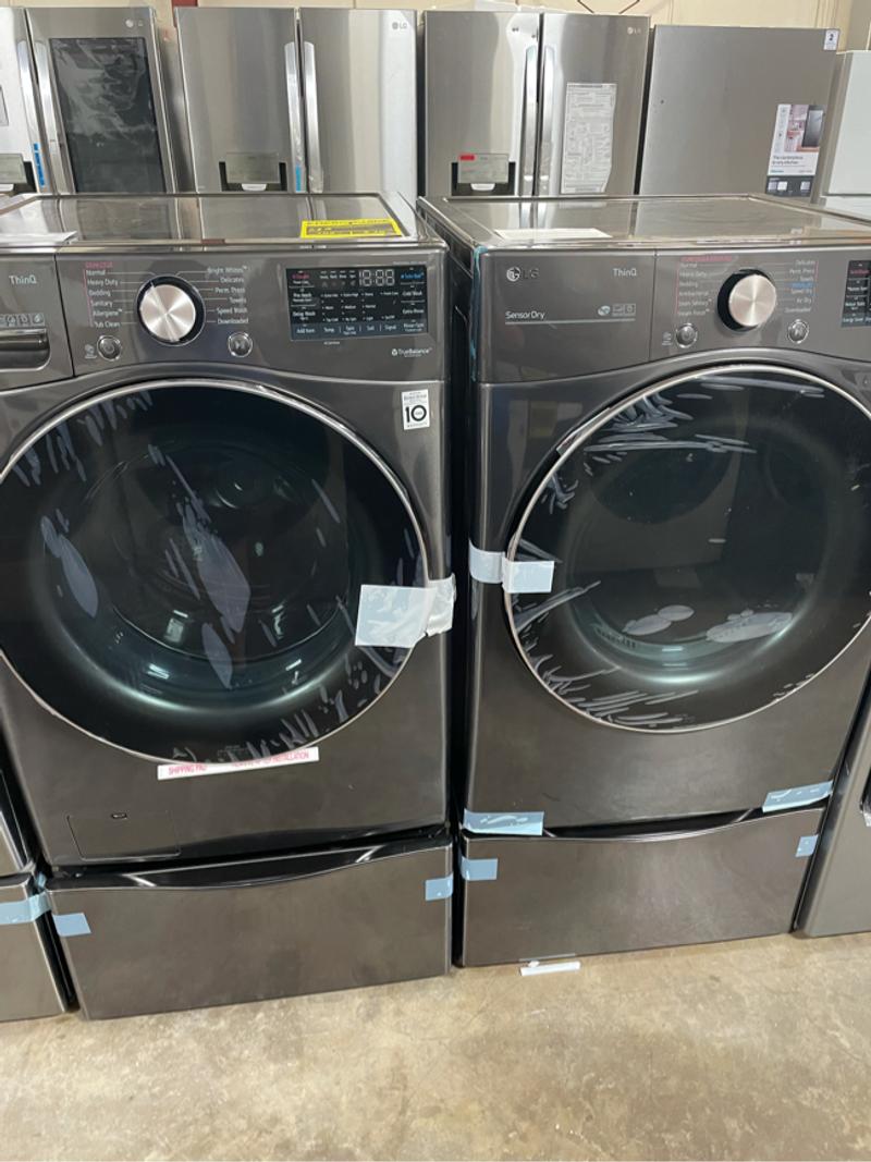 Black stainless steel front load washer and dryer set for sale in