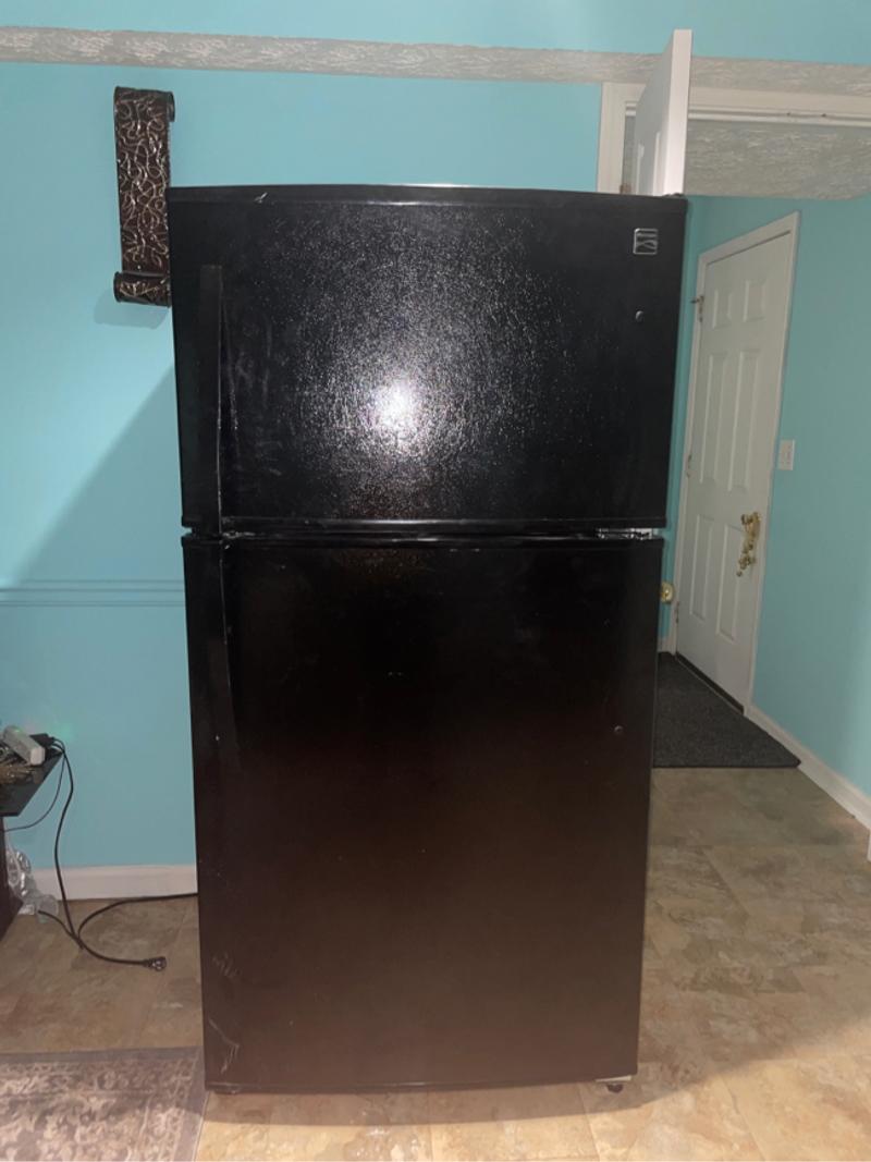 Kenmore black refrigerator is in good condition everything works very