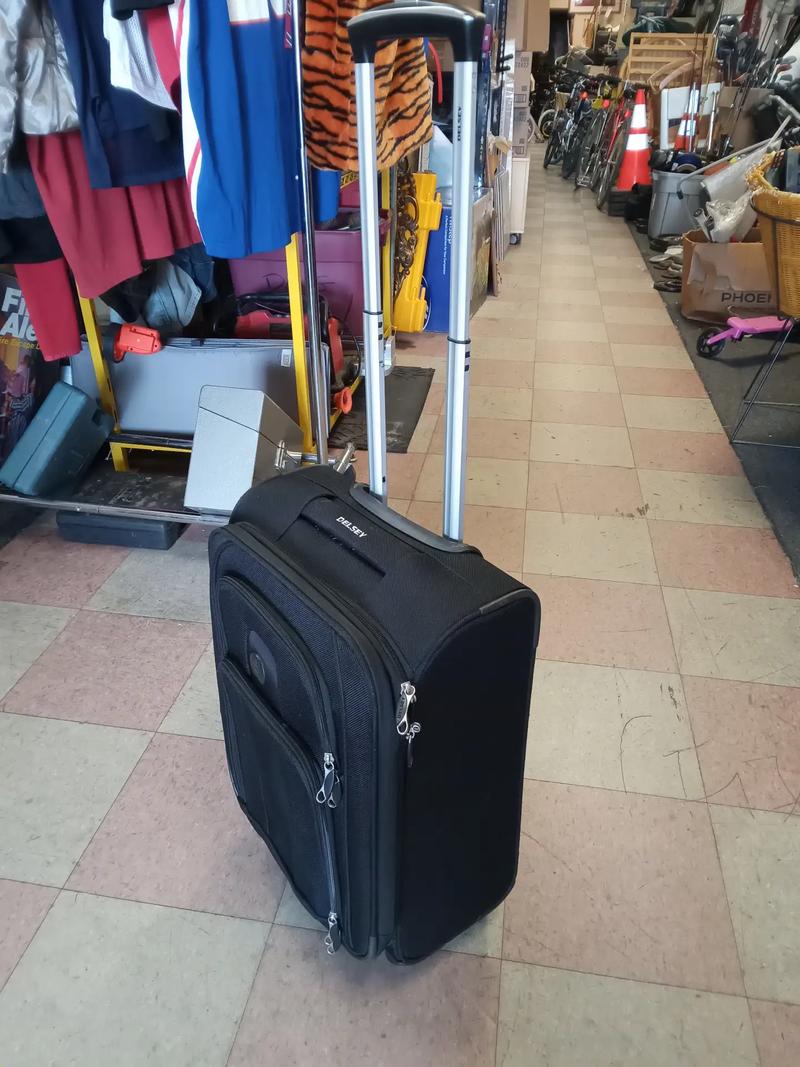 Carry on size luggage in great shape four wheels move smoothly three